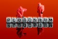 Model team in chemical suits with the word plutonium on beads Royalty Free Stock Photo