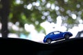Model toy car with bokeh green natural background Royalty Free Stock Photo