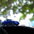 Model toy car with bokeh green natural background Royalty Free Stock Photo