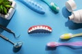 Model upper jaw prosthesis, toothpaste, toothbrush and dental tools Royalty Free Stock Photo