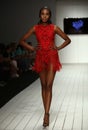 A model walks runway in designer swim apparel during the Furne Amato fashion show