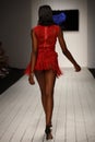 A model walks runway in designer swim apparel during the Furne Amato fashion show