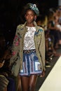 A model walks the runway at Desigual fashion show