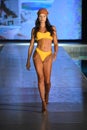 A model walks the runway for Almost Naked Swim Show