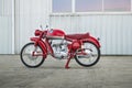 Brisbane, Queensland, Australia - May 15, 2021: Side view of a classic red 1954 MV Agusta 175 CSS Disco Volante motorcycle.