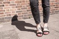 Model wearing black and white sandals with zebra print. Royalty Free Stock Photo