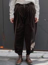 Model wearing Corduroy pants brown loose fit dark brown color paired indoor