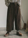 Model wearing Corduroy pants brown loose fit dark brown color paired indoor