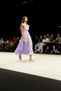 Model wearing a lilac coloured dress on the catwalk during the Adlib fashion collection at Momad 2023