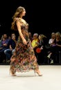 Model wearing a multi colour long dress on the catwalk during the Adlib fashion collection at Momad 2023