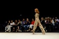 Model wearing a multi colour trousers suit on the catwalk during the Adlib fashion collection at Momad 2023