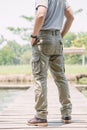 Model wearing sofe green color cargo pants or cargo trousers