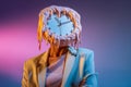 Portrait of person with dripping clock mask exploring time distortion in surreal theme Royalty Free Stock Photo