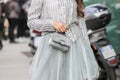 Model wears a silver long-sleeved shirt and a tulle skirt during the Armani fashion show at the women`s fashion week fall / winter