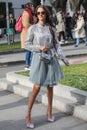 Model wears a silver long-sleeved shirt and a tulle skirt during the Armani fashion show at the women`s fashion week fall / winter