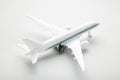 Model white airplane on a grey background Royalty Free Stock Photo