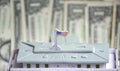 model of a white house on the background of us dollars