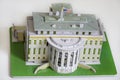 Model of the White House of the President on the background of dollars