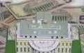 Model of the White House of the President on the background of dollars