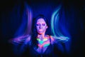 Model woman in neon light, beautiful model girl with fluorescent makeup, art design of disco dancer dancing in uv light Royalty Free Stock Photo