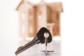 Model of wooden house with house key Royalty Free Stock Photo