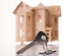 Model of wooden house with house key Royalty Free Stock Photo