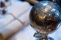 Modeled globe made of metal on the table