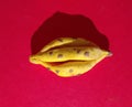 Modeling clay figure, banana on red background, concept, minimalism