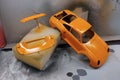 Modeling scale models. Paint the spoiler, trunk lid and toy body in a bright orange color