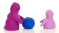 Modelling clay figures with a ball Royalty Free Stock Photo