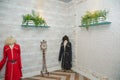 Models of Azerbaijani national dance costumes . Bottom hanging from the wall . Bottom view of beautiful flower pots on