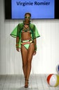 Models grace the catwalk in designer swim apparel during the Art Institute's fashion show