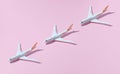 Models plane, airplanes on pink color background. Travel concept with planes