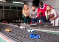 Models of race cars on track