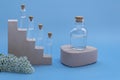 Models of samples of perfumery, aromatic oils on podiums on a colored background. Mock up with copy space. Bottles for branding Royalty Free Stock Photo