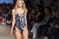 Models with swimsuit posing in fashion show