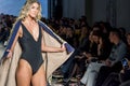 Models with swimsuit posing in fashion show