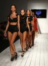 Models walk runway in designer swim apparel during the Furne Amato fashion show
