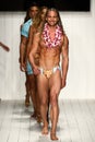 Models walk the runway finale in designer swim apparel during the Koco Blaq fashion show
