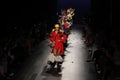 Models walk the runway finale for Desigual fashion show