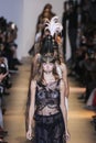 Models walk the runway finale during the John Galliano show