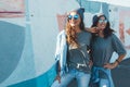 Models wearing plain tshirt and sunglasses posing over street wa Royalty Free Stock Photo