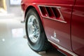 Ferrari 275 GTS red sports car in Museum Enzo Ferrari Modena focused on Pininfarina logo Royalty Free Stock Photo