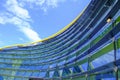 Modena, Italy: Exterior of the glass blue buildings of the Ferrari Museum and its yard with visitors.