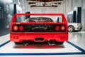 Modena, Italy - July 14, 2021: Red racing Ferrari F40 model rear view high-performance Italian sports rear mid-engine car