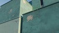 Modern abstract architecture with weathered teal concrete walls and cracked texture Royalty Free Stock Photo