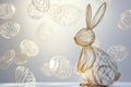 A modern, abstract Easter Bunny made of sleek metallic lines, standing in front of a minimalist Royalty Free Stock Photo