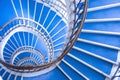 Modern abstract spiral staircase, bauhaus style, blue and white staircase