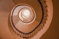 Modern abstract spiral staircase from below, bauhaus style, golden warm tone