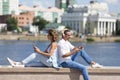 Modern addictions - a man and a woman sit buried in smartphones during a date. Royalty Free Stock Photo